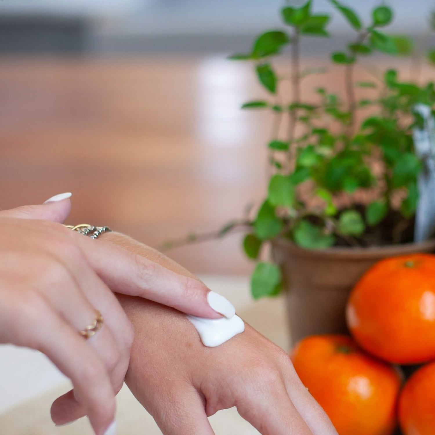 image of lotion being applied to hands